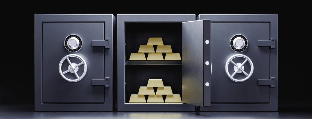 Three safes side-by-side; the outer two safes are closed. The middle safe is open and contains two pyramidal stacks of gold bars.