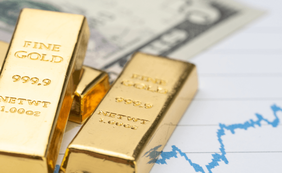 Three gold bars on a $5 bill and a blue line graph.